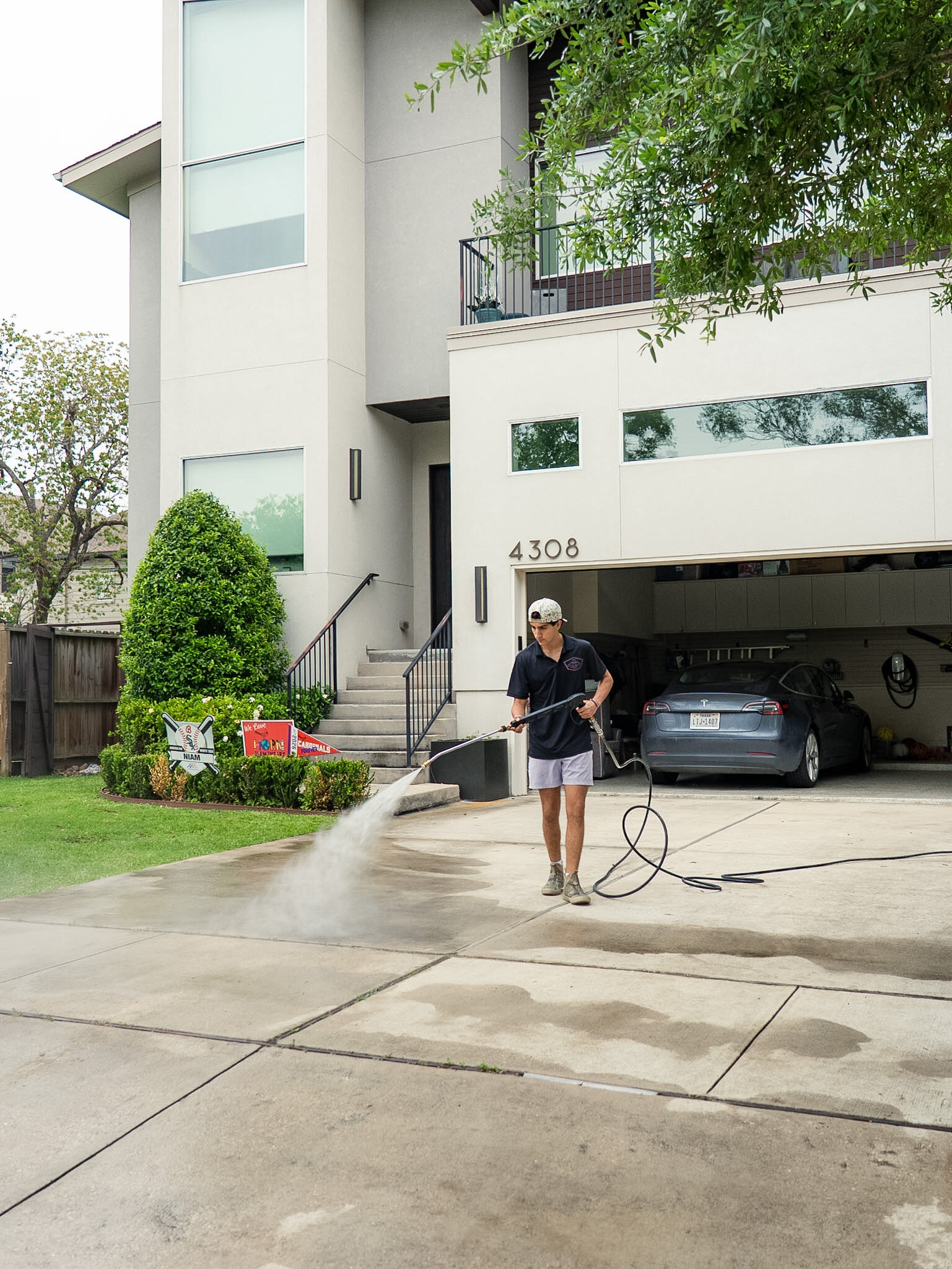 Bellaire Pro Wash technician cleaning a residential driveway